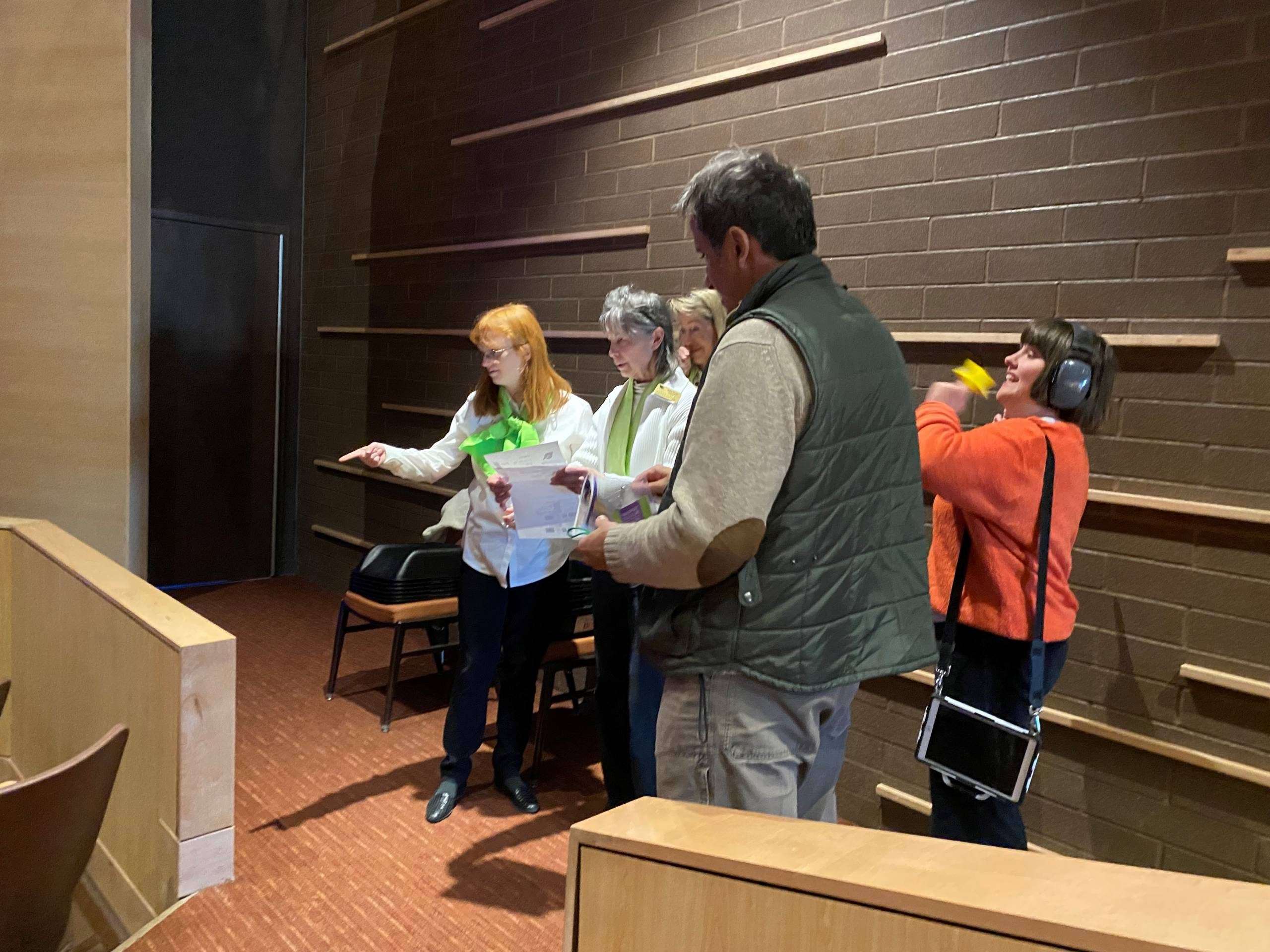 Our Wellspring STAR usher and mentor usher help direct patrons to their seats in the theater.