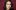 Actress Adriane Leigh Robinson in front of a burgundy background
